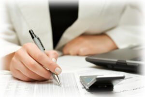 Businesswoman working with financial reports.